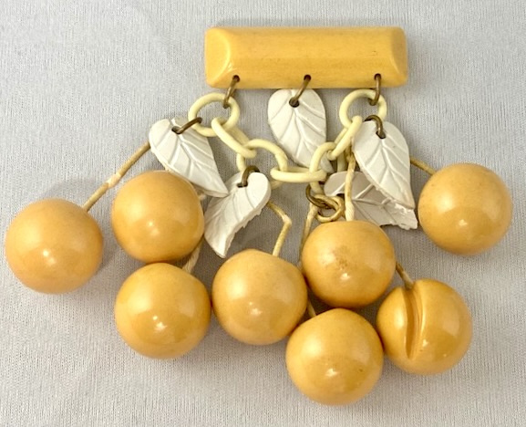 BP138  large cream bakelite cherry charm pin